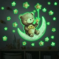 Glow-in-the-dark bear and moon wall stickers showing green fluorescent effect in dark room - 30x40cm / Green Fluorescent