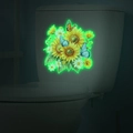 Luminous wall sticker showing glowing sunflower and butterfly patterns in dark bathroom - Green Glow (MG-YM036)