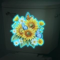 Glow-in-the-dark floral wall stickers with sunflowers and butterflies on toilet tank - Blue Glow (MG-YM036)
