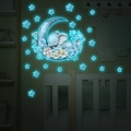Luminous wall sticker showing cartoon elephant sleeping on the moon with glowing stars - 30*40cm / Blue Glow (MG-YP038)
