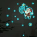 Adesivo murale natalizio fosforescente con Babbo Natale e stelle a luce blu brillante - Luce Blu (13x13cm)