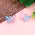 Graziosi ciondoli a farfalla in resina sfumata blu e rosa con paillettes lucide - 14x19mm / Farfalla in Resina Blu Rosa (17055)