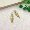 Pair of antique gold feather pendants for DIY jewelry making with detailed textures - Feather Shape (10223)