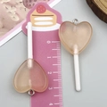 Pendentif sucette coeur en résine rose pêche avec paillettes pour création de bijoux - Sucette Cœur Transparent Café Clair (24555)