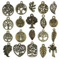 Macro detail of 20 bronze tree of life pendants with hollow engraving and family inscriptions - Tree and Leaf Series (SN889) / 20 Pieces Set / Antique Bronze