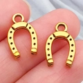 Pair of vintage gold horseshoe charms with black dot details and top hanging rings - Western Cowboy Perforated Horseshoe (19230)