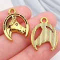 Golden horseshoe and horse head alloy pendant showing front relief and back texture detail - Western Cowboy Horseshoe (19247)