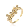 Macro shot of gold floral ring with micro-set cubic zirconia on open adjustable band - Gold White Zirconia