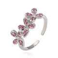 Detailed macro view of silver bow-knot ring featuring shimmering pink crystal inlay details - Platinum Plated Rose Red Zirconia
