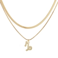 Detail of gold double-layered snake chain necklace with Capricorn zodiac pendant - Gold Capricorn