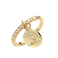 Detail view of gold adjustable zodiac ring featuring a sparkling Pisces pendant with cubic zirconia - Pisces / Gold