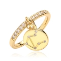 Detailed macro view of gold Libra zodiac ring with cubic zirconia and star map charm - Libra / Gold