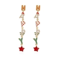 Detailed view of long HAPPY Christmas earrings with red star gemstone and holiday elements - Gold HAPPY Letter Style