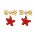 Detailed view of sweet bow earrings with red star pendants in gold finish - Gold Red Starfish