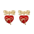 Detail of gold bow earrings with red enamel heart pendants and delicate metal ribbons - Gold Red Heart Bowknot