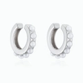 Macro detail of silver C-shaped ear cuffs set with glossy white pearls and metal base - Silver C-Shape Pearl