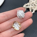 Macro detail of pearlescent shell charms for DIY jewelry with gold edges and holes - White Gold Dusted Shell Cabbage Petal (22131)