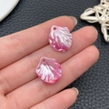 Detail view of two pink shell-shaped acrylic beads with iridescent finish for DIY jewelry - Iridescent Rose Red Cabbage Leaf (22006)
