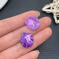 Detail view of two iridescent purple acrylic leaf pendants with AB coating for DIY jewelry - Iridescent Deep Purple Cabbage Leaf (22001)