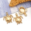 Macro detail of three golden turtle charms with hexagonal shell textures for DIY jewelry - Small Sea Turtle (T3038)