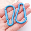 Detail view of two blue gourd-shaped aluminum carabiners with matte spray finish - Blue (26207)