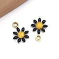 Macro detail of two black enamel daisy charms with yellow centers for DIY jewelry making - Black (Gold)