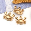 Three gold crab charms for DIY jewelry making on white surface with ocean decor - Large Crab (T3025) / 11x13x3mm