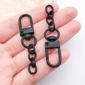 Matte black zinc alloy lobster clasp with a 4-link chain held by hand for scale - Black