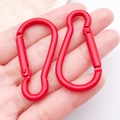 Gourd-shaped red aluminum carabiner keychain clip shown in hand for scale - Red (26205)