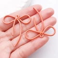 Ciondolo a fiocco rosso-arancio con trama a spirale per creazione di gioielli - Arancione