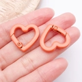 Pair of coral orange heart-shaped alloy spring hooks with matte finish for DIY accessories - Orange