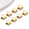Close-up of polished gold star-shaped stainless steel spacer beads for DIY jewelry making - Small Curved Star Style (T3014)