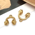 Macro detail of matte gold headphone pendant charms for DIY jewelry accessories - Music Headphones Style (T2842)