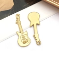 Close-up of golden guitar pendants showing intricate musical instrument details - Music Guitar (T2844)