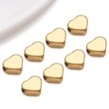 Detailed view of heart-shaped gold spacer beads with side holes for DIY jewelry making - Medium Flat Heart Style (T3018)