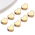 Macro shot of 8 golden heart-shaped stainless steel spacer beads for DIY jewelry making - Large Flat Heart Style (T3019)