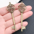 Set of two vintage bronze heart key pendants in alloy for DIY jewelry making - Antique Bronze Key Style (8752) / 2.2cmx7.0cm