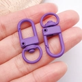 Detail view of purple matte finish alloy lobster clasps for DIY jewelry making - Oval Snap Hook (26366)