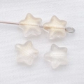 Macro shot of 8mm frosted star glass beads with gold glitter for DIY jewelry making - Transparent Gold Foil