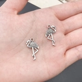 Silver flamingo alloy charms on a palm for size reference in DIY jewelry making - Flamingo (11241)