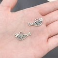 Pair of vintage silver bird alloy charms with feather textures for DIY jewelry making - Bird (3918)