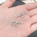 Pair of antique silver bird charms in镂空 design for DIY jewelry making and necklace crafts - Hollow Bird (7194)