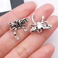 Colgantes de lazo en plata vintage para creación de joyas DIY con acabado antiguo - 20x18 mm / Lazo de Rosa (19430)