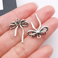 Ciondoli a fiocco fai-da-te in argento antico per collane con dettagli vintage - 25x18mm / Fiocco Cavo Argento Antico (26993)