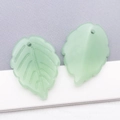 Detail showing two frosted light green glass strawberry leaf pendants with vein texture - Jelly Green (26905)