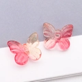Vue détaillée de perles papillon en verre dégradé rose avec trou pour la création de bijoux - Orange Rouge Transparent Dégradé