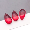 Close-up of three red gradient glass water drop beads with pre-drilled holes for DIY jewelry - Transparent Bright Red (Large)