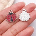 Breloques coccinelle en émail rouge avec dos argenté pour la création de bijoux DIY - Coccinelle Fleur Émail Rouge Argenté