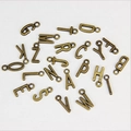 Detail view of antique bronze alloy letter charms for DIY jewelry and beaded crafts - Pendant Style (A) / Antique Bronze