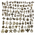 Macro view of assorted antique bronze alloy charms including owl and anchor for DIY jewelry - Antique Bronze Random 100 Styles